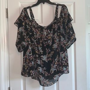 Off the shoulder floral print shirt.